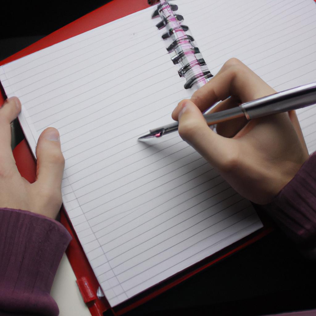 Person writing in notebook, analyzing